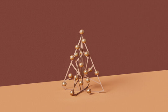 Geometric intersecting of papercraft Christmas tree with gold baubles