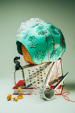 A conceptual set with a swimming pool cap and kitchen accessories.