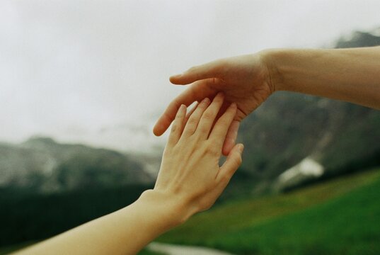 Romantic photo of hands touching