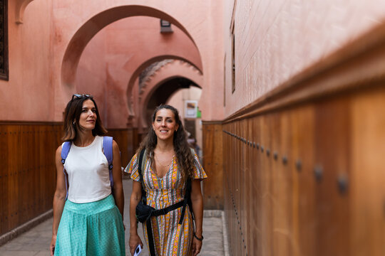 two happy women walking in the streets of Marrakech