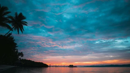 Fototapeten sunset over the sea © Angga