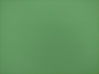 soft green background on a cement surface