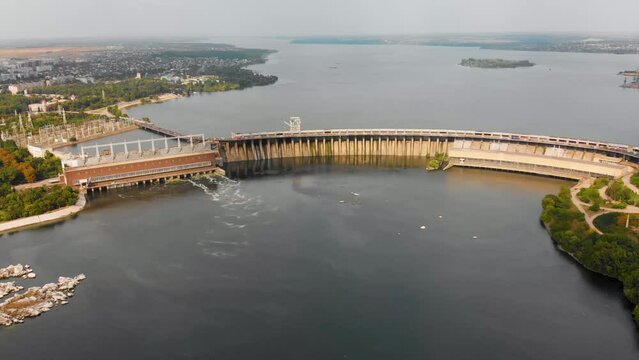 A beautiful view from above of the largest hydroelectric power plant in Ukraine - the Dnieper Hydroelectric Power Station. Dneproges before the shelling of Russian troops. Top view city of Zaporozhye.