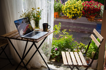 cup of coffe and flowers view and working at home 