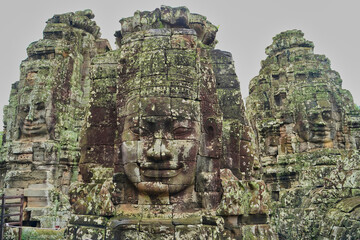 Fototapeta premium Bayon Temple - Masterpiece of Khmer Architecture built as a Buddhist temple by Jayavarman VII with over 200 towering smiling and serene looking Buddha faces at Siem Reap, Cambodia, Asia