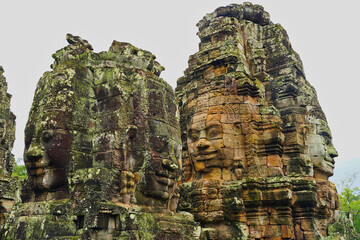 Fototapeta premium Bayon Temple - Masterpiece of Khmer Architecture built as a Buddhist temple by Jayavarman VII with over 200 towering smiling and serene looking Buddha faces at Siem Reap, Cambodia, Asia