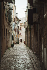 Fototapeta na wymiar Historic city postcard view - beautiful narrow street of medieval Rovinj Croatia