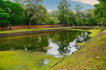 Baphuon Temple pool near the 11th century Shiva temple built by Suryavarman I, built in classic...