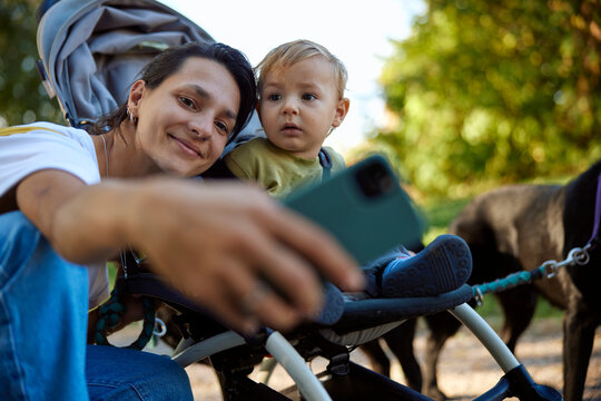 Mom taking a selfie with her son