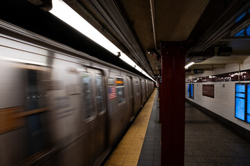 Speeding subway train in Manhattan station