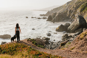 Woman with dog at beach