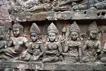 Fototapeta premium Bas reliefs depicting scenes from Hindu mythology at Terrace of the Leper King at Siem Reap, Cambodia, Asia