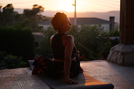 Cancer survivor woman doing yoga outdoors