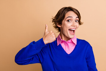 Photo portrait of pretty young girl show excited thumb up dressed stylish blue outfit isolated on...