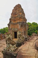 East Mebon - 10th century classical Khmer pyramid temple complex built by Rajendravarman in red...