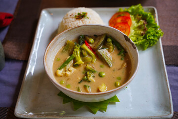 Fototapeta premium Cambodian Vegetable Curry and Rice served in a restaurant at Siem Reap, Cambodia, Asia