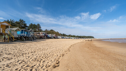raditional wooden beach huts on the sand in Wells on the North Norfolk coast