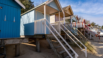 Close up of wooden beach huts on the sand at Wells beach on the North Norfolk coast