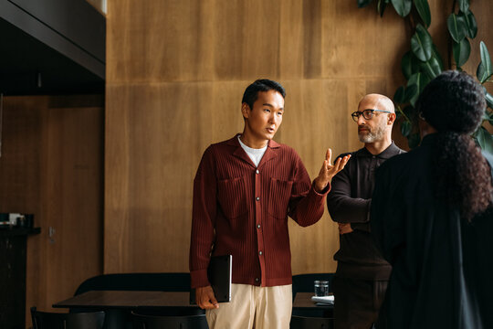 Colleagues standing in cafe