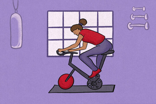 Woman using exercise bike