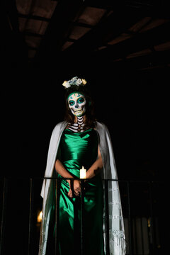 Woman with camera costume for the day of the dead.