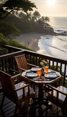 Wooden balcony overlooking tropical beach, surrounded by lush foliage, perfect for stock agency use and marketing campaigns. Table set for two with stunning sunset view. Vertical Composition.