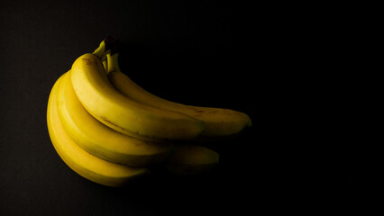 banana on black background illustration national banana day