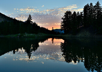 Sunrise reflected in Ridge Lake at Lassen Volcanic National Park, California.
