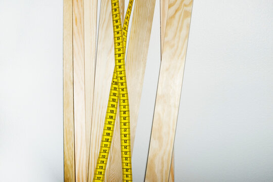Wood sticks and measuring tape with hard direct flashlight