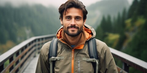 Fototapeta premium A male tourist stands on a mountain bridge in the Alps. Generative AI.