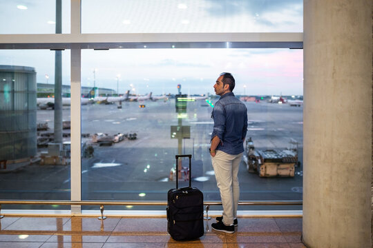 man waiting for his plane flight at an airport