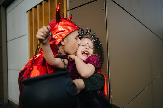 Daughter and father on Halloween party