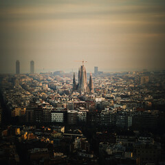 The Barcelona city skyline, depicting the Sagrada Famila in the evening. 