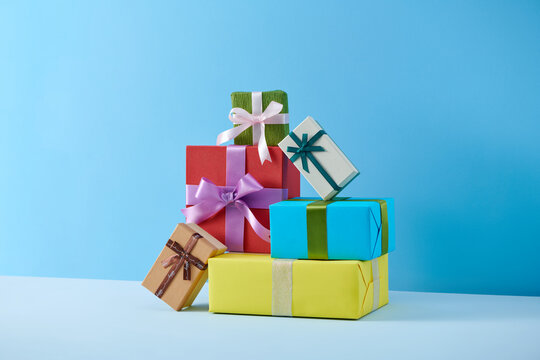 Christmas box gifts with satin bow isolated on color background