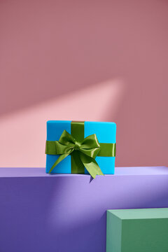 Gift box on table on light background