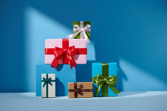 Hill colorful gifts isolated on blue background