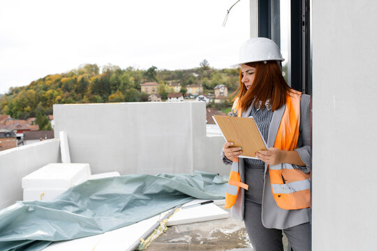 Woman engineer inspecting constraction site