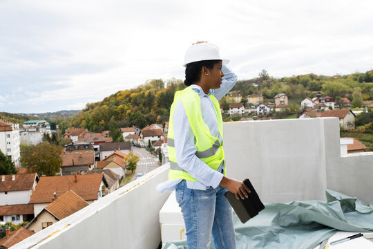 Woman engineer inspecting constraction site