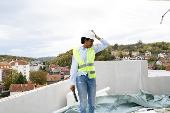 Woman engineer inspecting constraction site