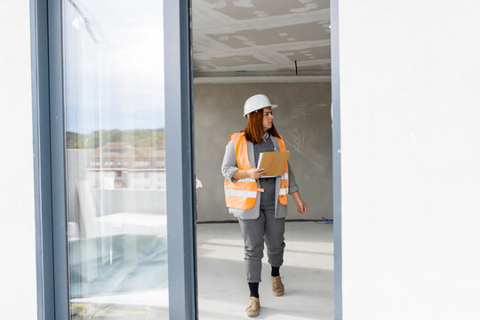 Woman engineer inspecting constraction site