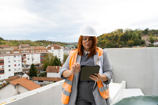 Woman engineer inspecting constraction site