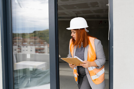 Woman engineer inspecting constraction site