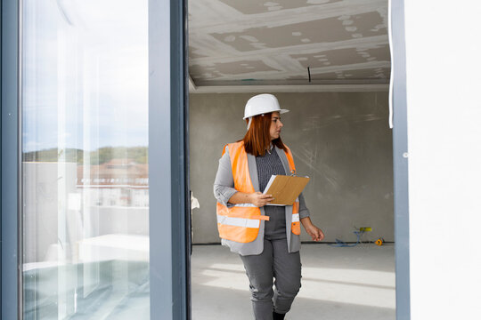 Woman engineer inspecting constraction site