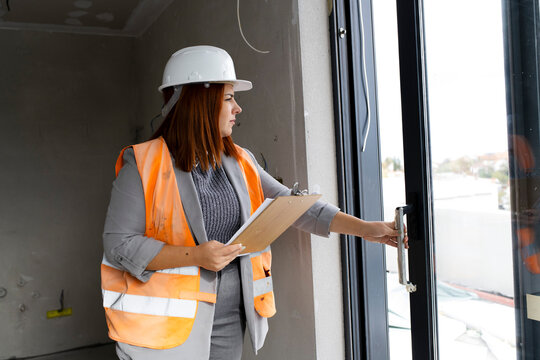 Woman engineer inspecting constraction site