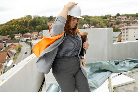 Woman engineer inspecting constraction site