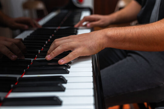 ugc of teenager playing a grand piano