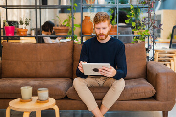 Modern Office and Sofa Work with Tablet