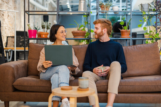 Business People Discuss A Project In The Company Lounge