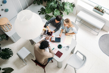 Women choosing fabric with client