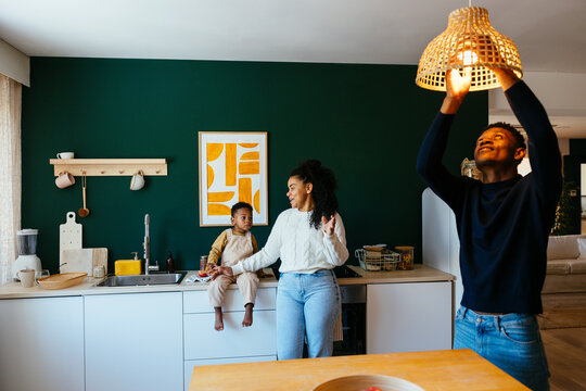 Young parents and son spending time together at home
